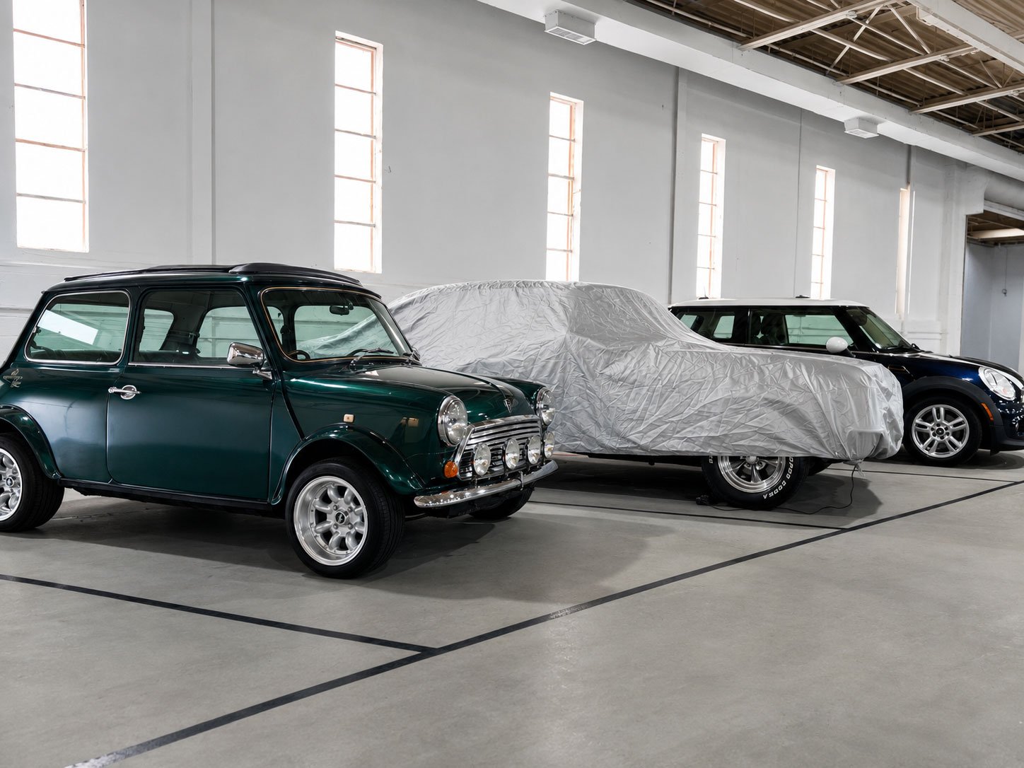 Classic Mini and covered vehicle in climate controlled storage with battery tender