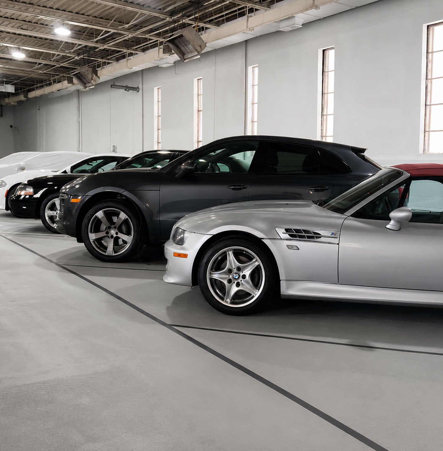 Storage-August-2 BMW Z3 M Coupe and covered cars in indoor vehicle storage